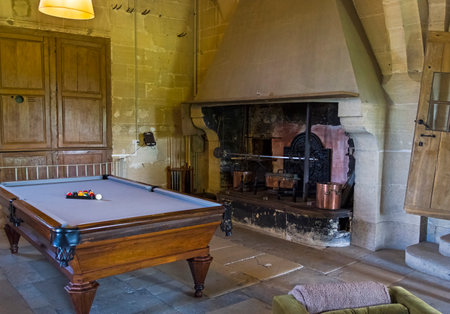 Billiard table in the room of the old castle. Grand Mello Castle, France.