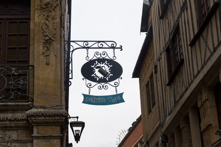 Rouen, France - August 30, 2018: Signboard Delirium cafe against the sky. Rouen, Normandy, France.