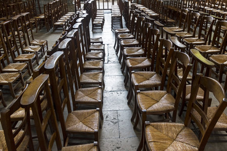 Chairs for parishioners in a catholic church. Notre-Dame de Rouen Cathedral, Rouen, France.