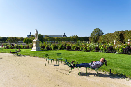 Paris, France - September 3, 2018: 
Two chairs on the path in the Tuileries garden, Paris, France. Sunny day in early September.のeditorial素材