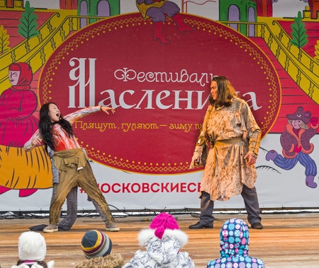 Moscow, Russia -  February 17, 2018: The performance of the Yakut theater "Olonkho" at the Pancake Week festival in Moscow. Children at the scene look at the show. February 2018.のeditorial素材
