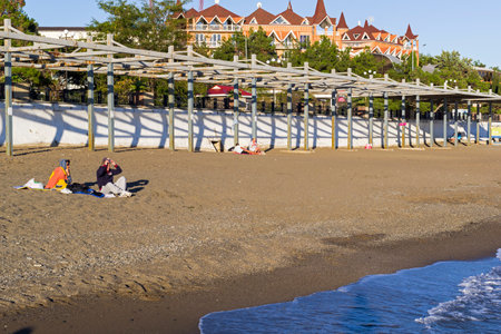 Sudak, Crimea - September 28, 2018: A few people on a beach. Sudak, Crimea. Sunny evening at the end of September.のeditorial素材