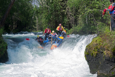 Buryatia, Russia - July 31, 2019: Sports catamaran on the rapids. The "Catapult" rapids on the Zhom-Bolok River. East Sayan, Buryatia, Siberia, Russia.のeditorial素材