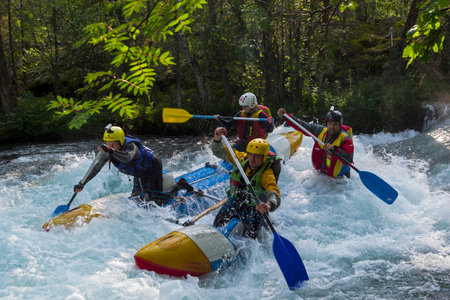 Buryatia, Russia - July 31, 2019: Sports catamaran on the rapids. The "Touchy" rapids on the Zhom-Bolok River. East Sayan, Buryatia, Siberia, Russia.のeditorial素材