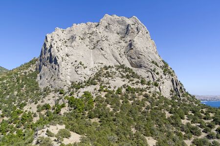 Crimea. View of Mount Sokol (Kush-Kaya) from Novyy Svet. Sunny day in September.