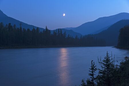 Moonlit night on the river. Thr Oka Sayan river in the Orkho-Bom gorge. East Sayan, Buryatia, Siberia, Russia. の写真素材