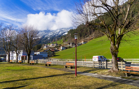 Ziller Valley, Austria - March 8, 2020: Footpath along the highway. Zillertal Valley, Tyrol, Austria. Sunny day in early May.のeditorial素材