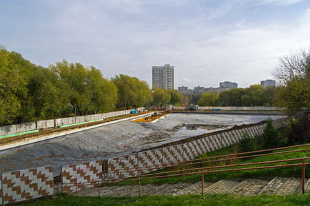 Reconstruction of Small Konkovsky pond, south-Western District of Moscow. The bottom of the pond is covered with a waterproofing material.の写真素材