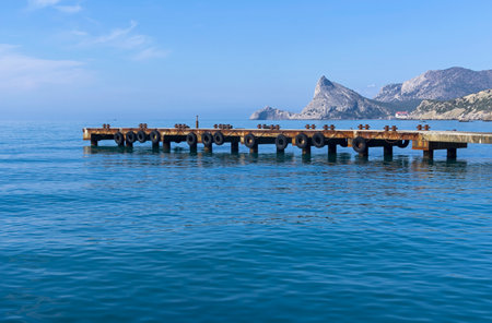 View from the resort town of Sudak towards the Oryol and Kapchik capes in Novy Svet. Sunny morning, Crimea.の写真素材