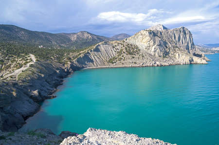 Beautiful seascape.  A small bay on the Black Sea coast, known in local toponymy as "Blue bay" or "Robber's bay". Novyi Svet, Crimea.の写真素材