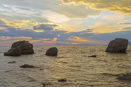 Sunset over the sea. Cape Meganom, Crimea, mid-October.の写真素材