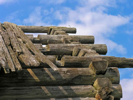 The roof of an abandoned decaying wooden house. Karelia, Russia.の写真素材