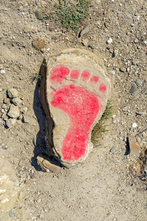 Funny drawing on a stone - a footprint. Cape Meganom, Crimea.の写真素材
