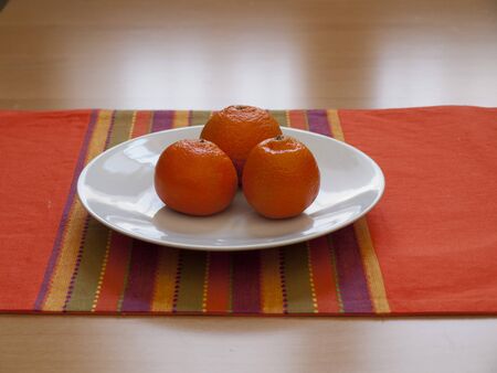 Close up view of organic Mandarins in a plateの写真素材