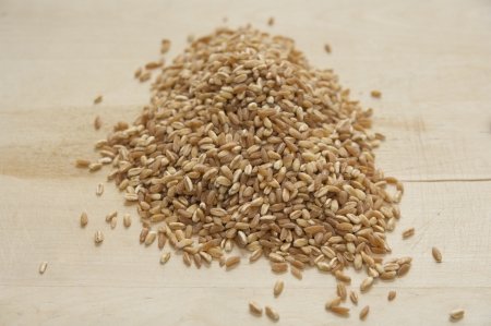 Close up view of organic Spelt on a boardの写真素材