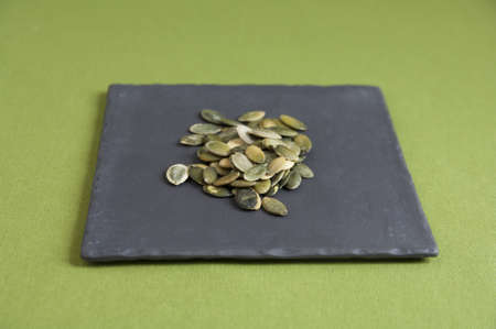 Close up view of organic Toasted Pumpkin Seeds in a plateの写真素材