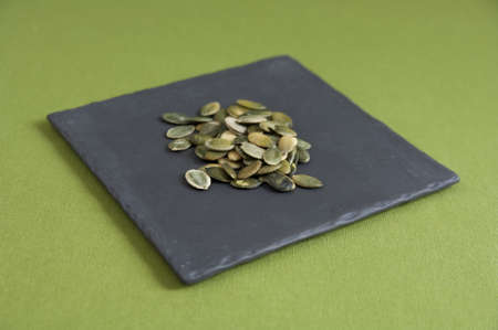 Close up view of organic Toasted Pumpkin Seeds in a plateの写真素材