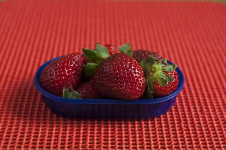 Close up view of organic Strawberry in a basketの写真素材