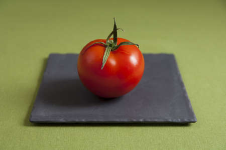 Close up view of a Tomato on a plateの写真素材