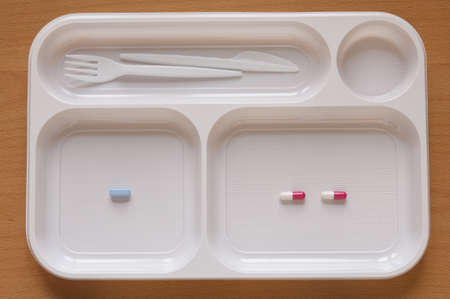 Close-up view of large number of Nutritional Supplement Tablets in a food tray  Multivitamin Pills...