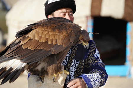 Kosh-Agach,Russia - September 21, 2014: the hunter with an eagle at the festival: Berkut-wing Chu...