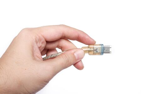 DVI firewire cable in hand on isolatedの写真素材