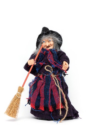 Old Halloween witch with broomstick and hat isolated on white backgroundの写真素材