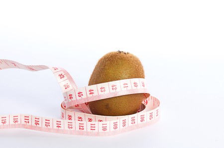 Kiwi tropical fruit and tape measurementの写真素材