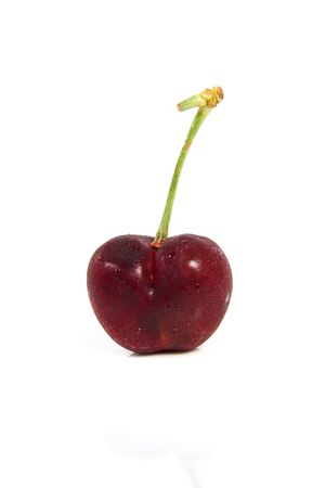 Red cherry with dewdrops on isolated whiteの写真素材