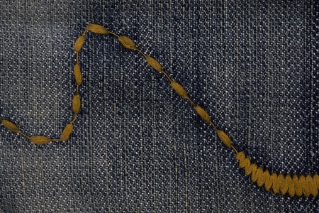 Extreme close up old denim background and with seam
