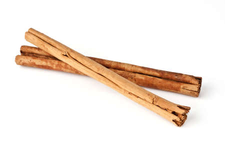 Cinnamon sticks isolated on white backgroundの写真素材