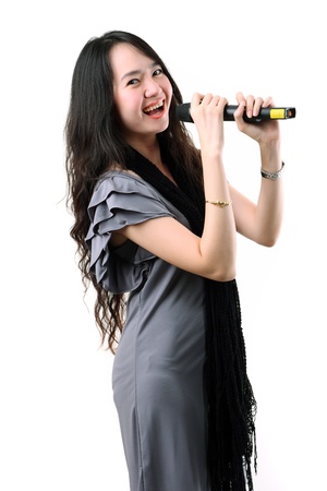 Asian karaoke singer isolated on a white background の写真素材