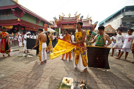 PHUKET, THAILAND - OCTOBER 20, 2012 : A Taoist devotee participates in the Phuket Vegetarian Festival on Oct 20, 2012 in Phuket, Thailand. The festival ritual mortification is practiced to appease the Gods.のeditorial素材