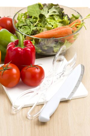 Mix of vegetables on salad on wood background.の写真素材