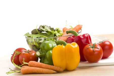 Mix of vegetables on salad on wood background.の写真素材