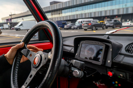 View of the steering wheel of a vintage car. Electronic digital dashboardの写真素材