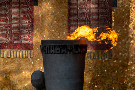 Burning torch on the background of the wall of the building. Volgograd, Russia