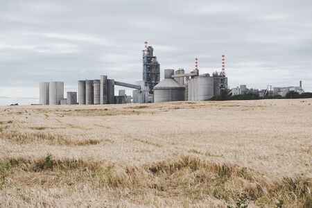 A factory in Ireland close to fields. Modern granary and mill. Irish factory from concrete. Industrial view.の写真素材