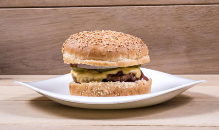 Image of burger on white plate wood backgroundの写真素材