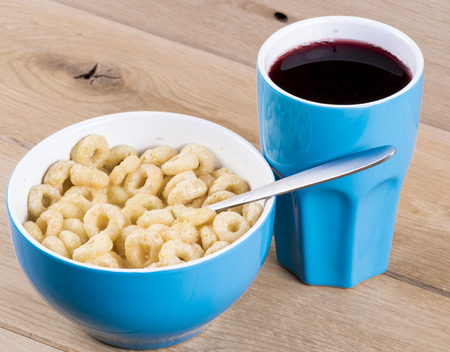 Image of cereal breakfast in bowl and juice close up.の写真素材