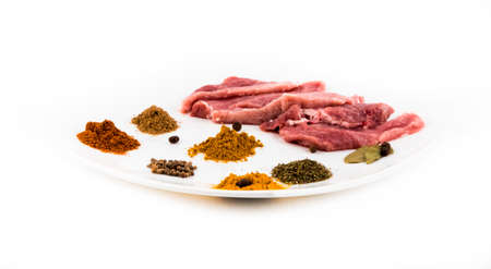 Image of raw red meat with spice on the plate close up.の写真素材