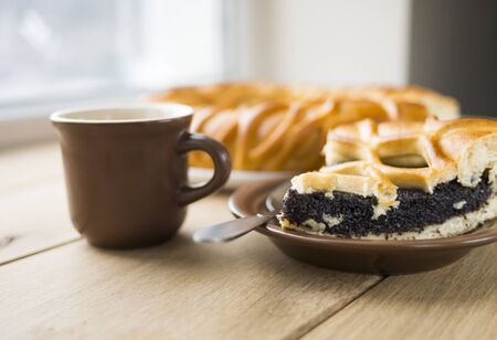 Image of Poppe pie and coffee in the morning with window background.の写真素材