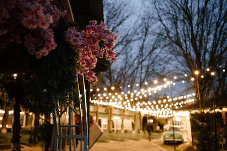 Outdoor Evening Market with String Lights and Flowers