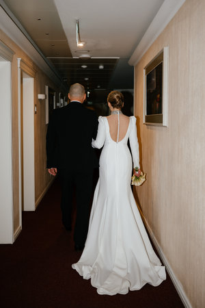 Newlyweds Walking Down the Hallwayの写真素材