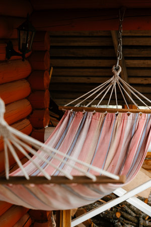 Cozy Hammock on Rustic Wooden Porchの写真素材