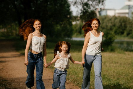 Three Women Joyfully Walking in Natureの写真素材