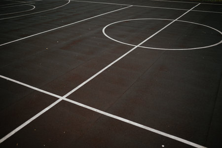Empty Outdoor Basketball Court with White Linesの写真素材