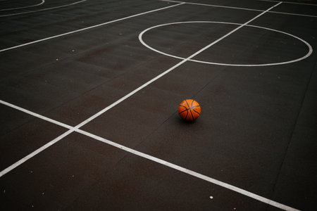 Basketball on Empty Court Capturing Stillnessの写真素材