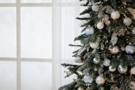 Elegant Christmas Tree with White and Silver Ornamentsの写真素材