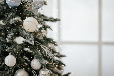 Elegant Christmas Tree with White and Silver Ornamentsの写真素材